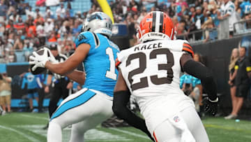 Carolina Panthers wideout Jalen Coker (18) catches a touchdown pass with Browns safety Damontae Kazee (23) in coverage