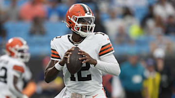 Aug 8, 2025; Charlotte, North Carolina, USA; Cleveland Browns quarterback Shedeur Sanders (12) drops back to pass against the Carolina Panthers during the first quarter at Bank of America Stadium. Mandatory Credit: Jim Dedmon-Imagn Images
