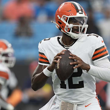 Aug 8, 2025; Charlotte, North Carolina, USA; Cleveland Browns quarterback Shedeur Sanders (12) drops back to pass against the Carolina Panthers during the first quarter at Bank of America Stadium. Mandatory Credit: Jim Dedmon-Imagn Images