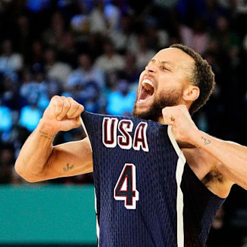 United States shooting guard Stephen Curry (4) celebrates in the second half against France in the men's basketball gold medal game during the Paris 2024 Olympic Summer Games at Accor Arena on Aug. 10, 2024.