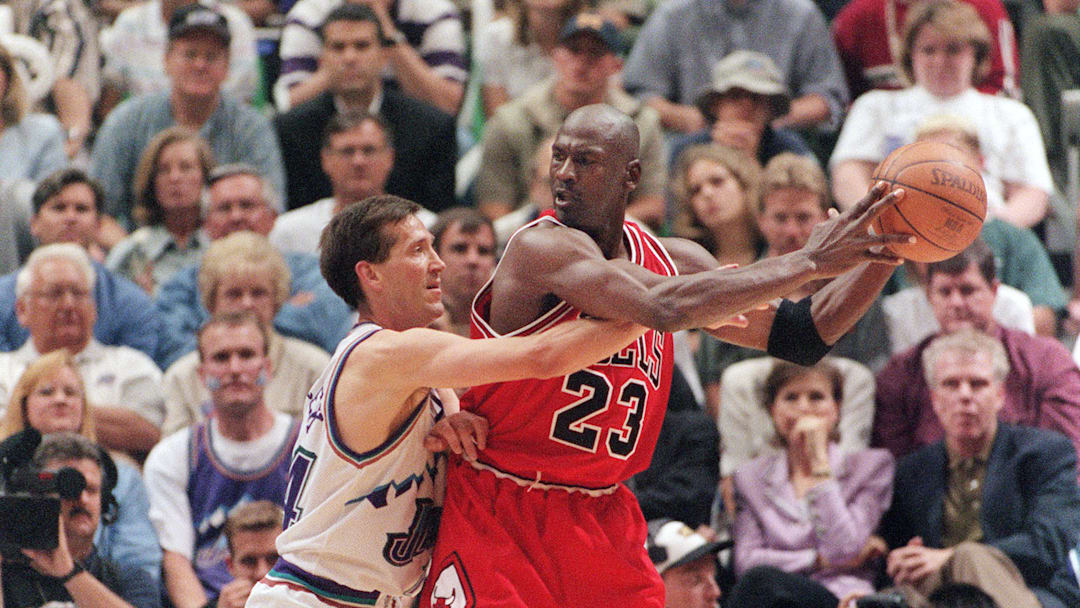 Michael Jordan (R) of the Chicago Bulls is guarded