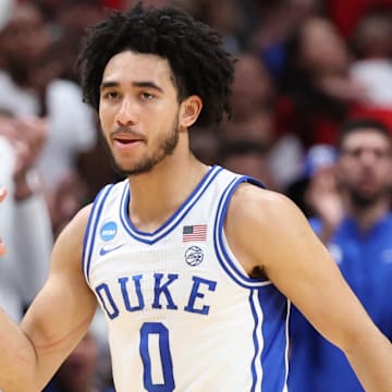Mar 31, 2024; Dallas, TX, USA; Duke Blue Devils guard Jared McCain (0) reacts in the first half against the North Carolina State Wolfpack in the finals of the South Regional of the 2024 NCAA Tournament at American Airline Center.