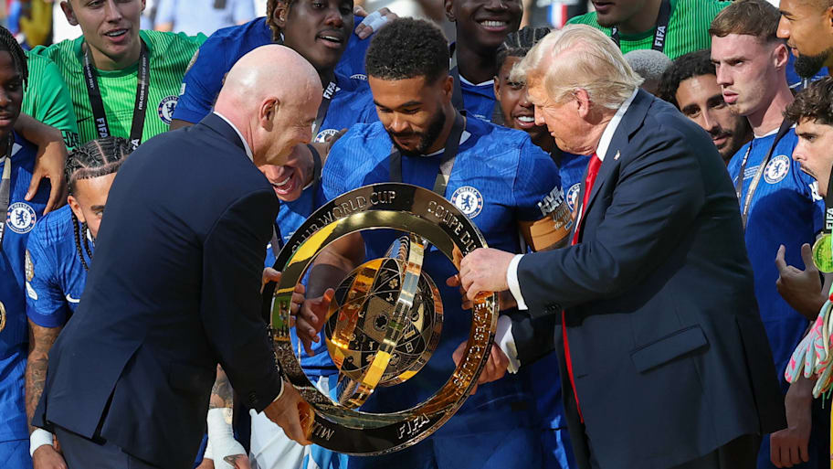 Gianni Infantino (left) and Donald Trump (right) both handed a replica Club World Cup trophy to Chelsea captain Reece James. | IMAGO/Icon Sportswire