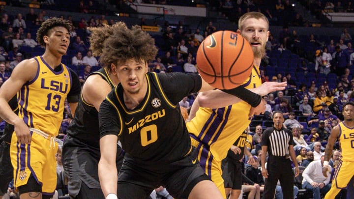 Mar 9, 2024; Baton Rouge, Louisiana, USA; Missouri Tigers forward Jordan Butler (0) goes for a loose ball against the LSU Tigers during the first half at Pete Maravich Assembly Center. Mandatory Credit: Stephen Lew-USA TODAY Sports