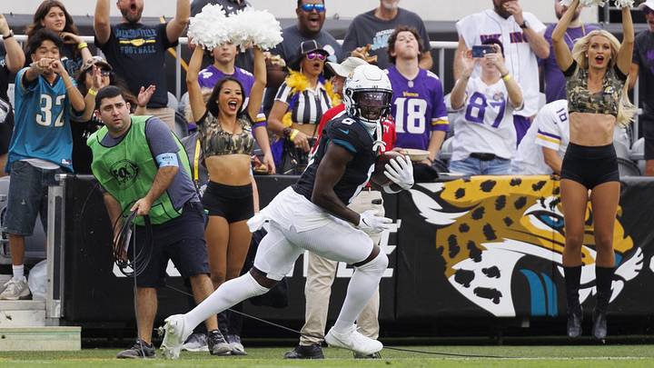 Nov 10, 2024; Jacksonville, Florida, USA; Jacksonville Jaguars safety Darnell Savage (6) makes an interception catch against the Minnesota Vikings during the third quarter at EverBank Stadium. 
