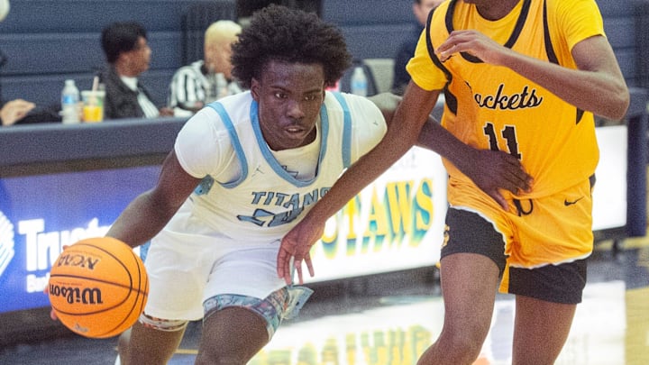 Richland's Phil Nelson (20) drives toward the basket past Starkville defender Justin Green (11) during the BA$$A Holiday Invitational 2023 in Clinton, Miss., Saturday, Dec. 23, 2023. Richland's Phil Nelson (20) drives toward the basket past Starkville defender Justin Green (11) during the BA$$A Holiday Invitational 2023 in Clinton, Miss., Saturday, Dec. 23, 2023.