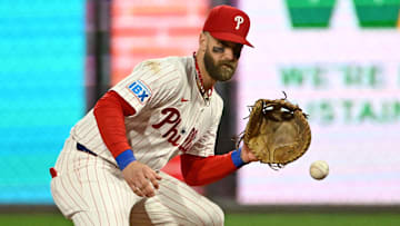 Sep 8, 2025; Philadelphia, Pennsylvania, USA; Philadelphia Phillies first base Bryce Harper (3) fields a ground ball during the fourth inning against the New York Mets at Citizens Bank Park.