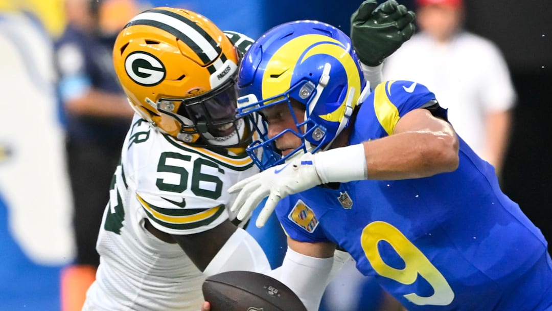 Green Bay Packers linebacker Edgerrin Cooper (56) sacks Los Angeles Rams quarterback Matthew Stafford.