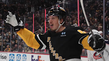 Jan 7, 2025; Pittsburgh, Pennsylvania, USA; Pittsburgh Penguins right wing Rickard Rakell (67) reacts after scoring a goal against the Columbus Blue Jackets during the third period at PPG Paints Arena. Mandatory Credit: Charles LeClaire-Imagn Images