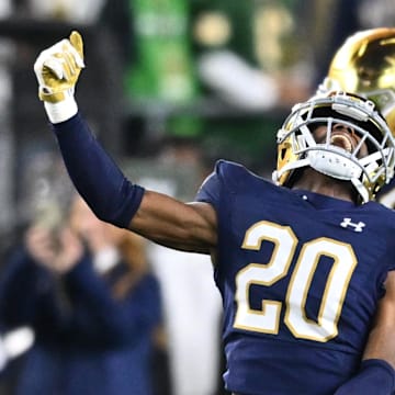 Oct 14, 2023; South Bend, Indiana, USA; Notre Dame Fighting Irish cornerback Benjamin Morrison (20) celebrates after an interception in the second quarter against the USC Trojans at Notre Dame Stadium. Mandatory Credit: Matt Cashore-Imagn Images