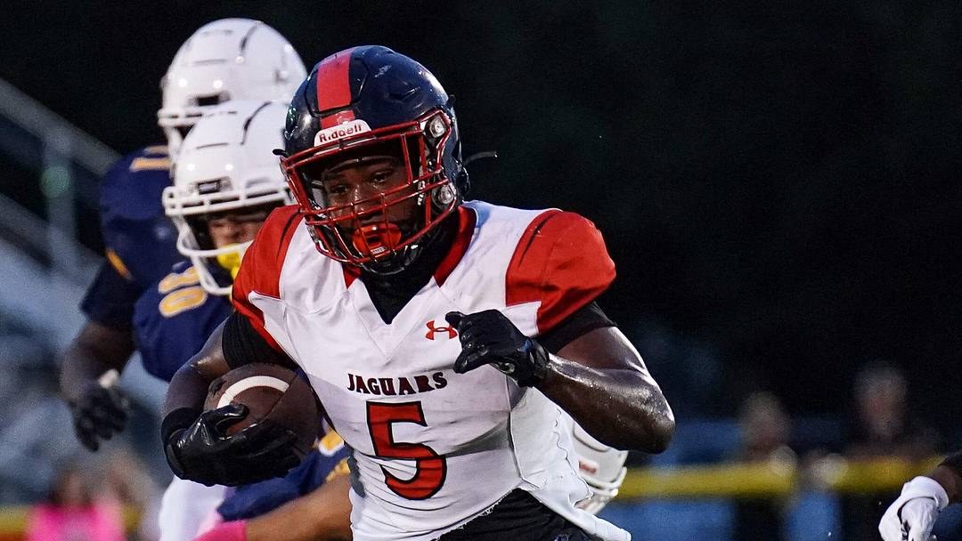 Port St. Lucie running back Terriel Harmon, Jr. gains yardage against Tradition Prep during a high school football game on Thursday, October 3, 2024 at South County Stadium in Port St. Lucie. Port St. Lucie running back Terriel Harmon, Jr. gains yardage against Tradition Prep during a high school football game on Thursday, October 3, 2024 at South County Stadium in Port St. Lucie.