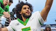 Oregon quarterback Dante Moore celebrates after the game as the Oregon Ducks take on the Washington Huskies on Nov. 29, 2025, at Husky Stadium in Seattle, Washington.
