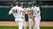 Michigan State's Sam Busch, left, crosses home plate after a home run against Ohio State during the fifth inning on Friday, April 18, 2025, at McLane Stadium in East Lansing. From left, MSU's Ryan McKay, Nick Williams and Parker Picot greet Bush at the plate.