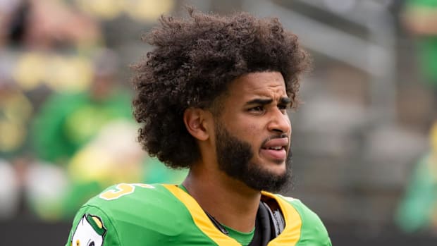 Oregon Ducks Dan Lanning Oklahoma State NIL Mike Gundy Dante Moore Noah Whittington Dakorien Moore Big Ten College Football 