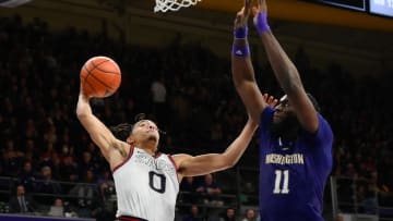 Gonzaga guard Ryan Nembhard droves on Washington center Franck Kepnang in their 2023 game in Seattle.