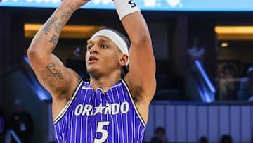 Orlando Magic forward Paolo Banchero shoots against Boston Celtics guard Derrick White.