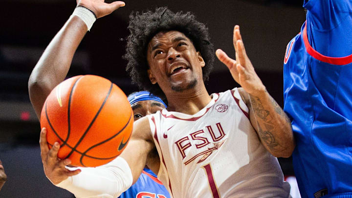 Florida State Seminoles guard Martin Somerville (1) tries to shoot from inside the paint but is surrounded by defenders. The Florida State Seminoles hosted the Southern Methodist University Mustangs at the Tucker Civic Center on Saturday, March 7, 2026.