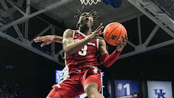 Arkansas Razorbacks forward Adou Thiero (3) got air for this reverse lay-up as he scored a team high 21 points as he helped lead the Razorbacks to a 89-79 win over No.12 Kentucky Saturday Feb. 1, 2025 at Rupp Arena in Lexington, Kentucky.
