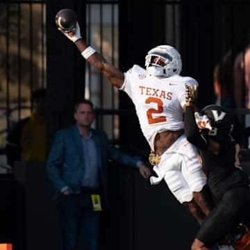 Texas Longhorns wide receiver Matthew Golden (2) hauls in a touchdown against Vanderbilt Commodores cornerback Tyson Russell.