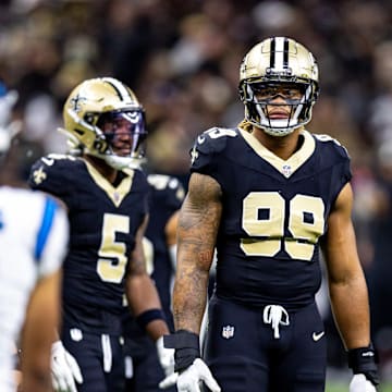 Sep 8, 2024; New Orleans, Louisiana, USA; Carolina Panthers defensive tackle Shy Tuttle (99) stares down Carolina Panthers quarterback Bryce Young (9) on a time out during the first half at Caesars Superdome.