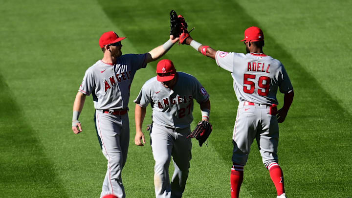 Sep 13, 2020; Denver, Colorado, USA; Los Angeles Angels left fielder Taylor Ward (3) and center fielder Mike Trout (27) and right fielder Jo Adell (59) celebrate defeating the Colorado Rockies at Coors Field. Mandatory Credit: Ron Chenoy-Imagn Images Sep 13, 2020; Denver, Colorado, USA; Los Angeles Angels left fielder Taylor Ward (3) and center fielder Mike Trout (27) and right fielder Jo Adell (59) celebrate defeating the Colorado Rockies at Coors Field. Mandatory Credit: Ron Chenoy-Imagn Images