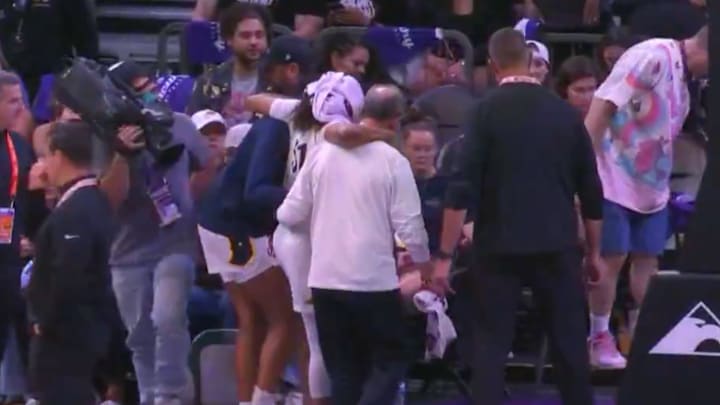 Sydney Colson suffered a knee injury and had to be helped off the court. 