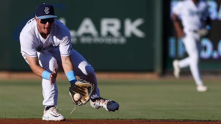 Hooks second baseman Will Wagner fields a ball to first base during the game against the Northwest