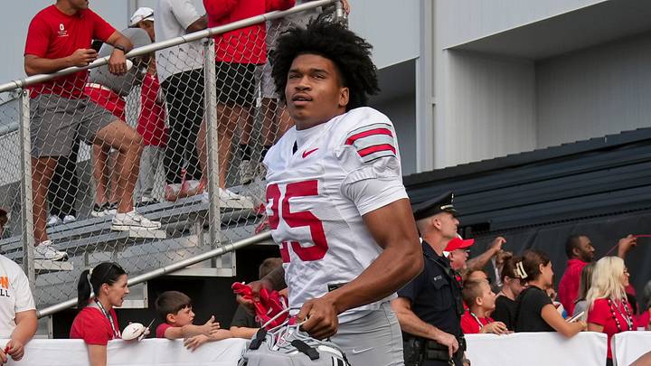 Ohio State Buckeyes cornerback Dominick Kelly (24) and cornerback Jay Timmons (25) take the field during the first practice of training camp at the Woody Hayes Athletic Center in Columbus on Aug. 6, 2026.