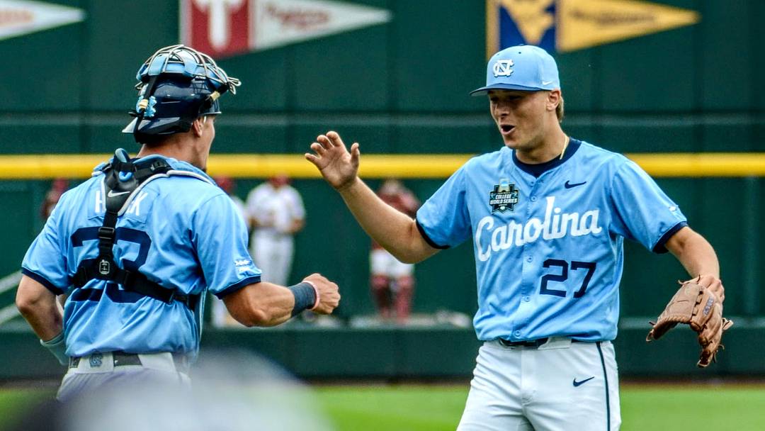 North Carolina pitcher Caden Glauber high fives his catcher after beating OU in Game 2 of the CWS Finals. North Carolina pitcher Caden Glauber high fives his catcher after beating OU in Game 2 of the CWS Finals.