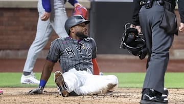 May 24, 2025; New York City, New York, USA;  New York Mets left fielder Starling Marte (6) sits on the field after getting thrown out at home plate in the fourth inning against the Los Angeles Dodgers at Citi Field. Mandatory Credit: Wendell Cruz-Imagn Images