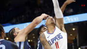 Jan 12, 2024; Memphis, Tennessee, USA; Los Angeles Clippers guard Jordan Miller (11) shoots as Memphis Grizzlies forward David Roddy (21) and forward GG Jackson (45) defends during the second half at FedExForum. Mandatory Credit: Petre Thomas-USA TODAY Sports