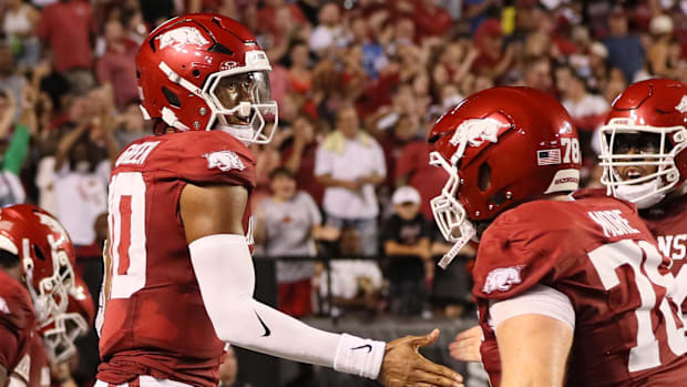 Razorbacks quarterback Taylen Green celebrates after scoring a touchdown.