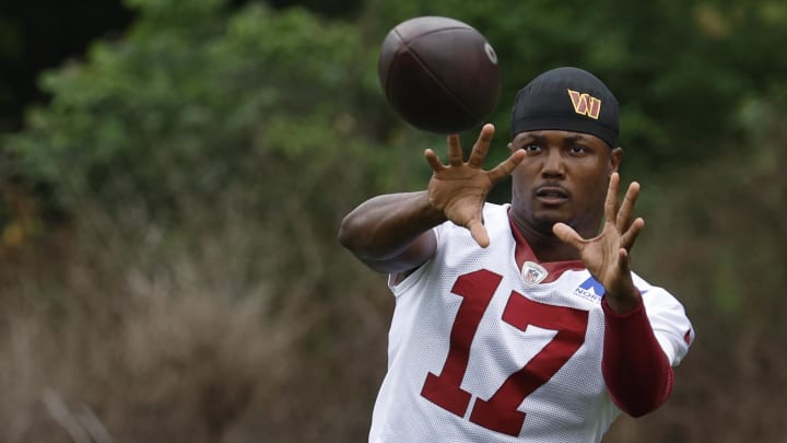 Jun 5, 2024; Ashburn, VA, USA; Washington Commanders wide receiver Terry McLaurin (17) catches a ball during warmup prior to an OTA workout at Commanders Park. Mandatory Credit: Geoff Burke-USA TODAY Sports