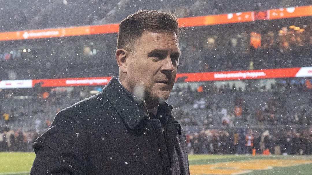 Green Bay Packers general manager Brian Gutekunst walks on the field prior to the playoff game against the Chicago Bears.
