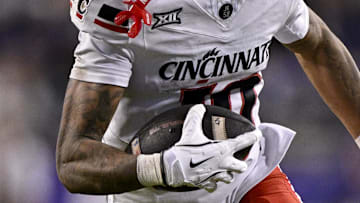 Nov 29, 2025; Fort Worth, Texas, USA; Cincinnati Bearcats wide receiver Caleb Goodie (10) runs with the ball during the game between the Horned Frogs and the Bearcats at Amon G. Carter Stadium. Mandatory Credit: Jerome Miron-Imagn Images