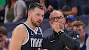 Dallas Mavericks guard Luka Doncic and head coach Jason Kidd talk during a game.