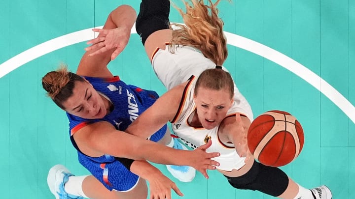 Aug 7, 2024; Paris, France; Germany power forward Marie Guelich (11) shoots the ball against France power forward Alexia Chery (6) in the women’s basketball quarterfinals during the Paris 2024 Olympic Summer Games at Accor Arena. Mandatory Credit: Kyle Terada-USA TODAY Sports