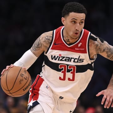 Mar 21, 2024; Washington, District of Columbia, USA; Washington Wizards forward Kyle Kuzma (33) drives to the basket as Sacramento Kings forward Keegan Murray (13) defends  during the second  half at Capital One Arena. Mandatory Credit: Tommy Gilligan-USA TODAY Sports