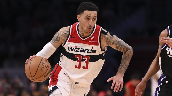 Mar 21, 2024; Washington, District of Columbia, USA; Washington Wizards forward Kyle Kuzma (33) drives to the basket as Sacramento Kings forward Keegan Murray (13) defends  during the second  half at Capital One Arena. Mandatory Credit: Tommy Gilligan-USA TODAY Sports