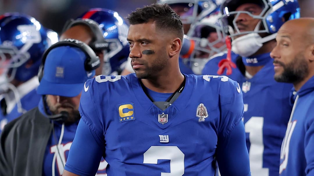 Oct 9, 2025; East Rutherford, New Jersey, USA; New York Giants quarterback Russell Wilson (3) watches from the sidelines during the second quarter against the Philadelphia Eagles at MetLife Stadium. Mandatory Credit: Brad Penner-Imagn Images