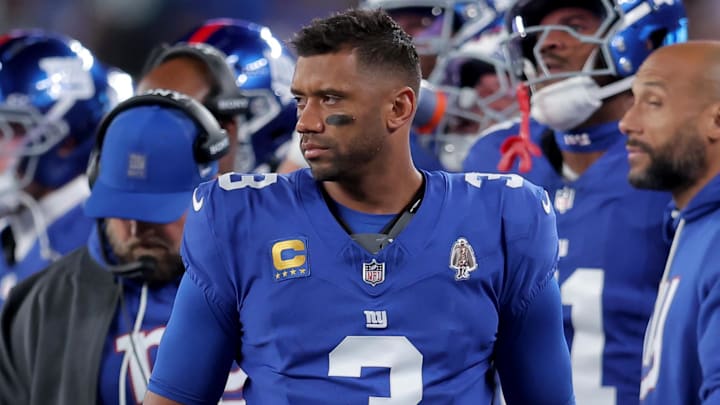 Oct 9, 2025; East Rutherford, New Jersey, USA; New York Giants quarterback Russell Wilson (3) watches from the sidelines during the second quarter against the Philadelphia Eagles at MetLife Stadium. Mandatory Credit: Brad Penner-Imagn Images