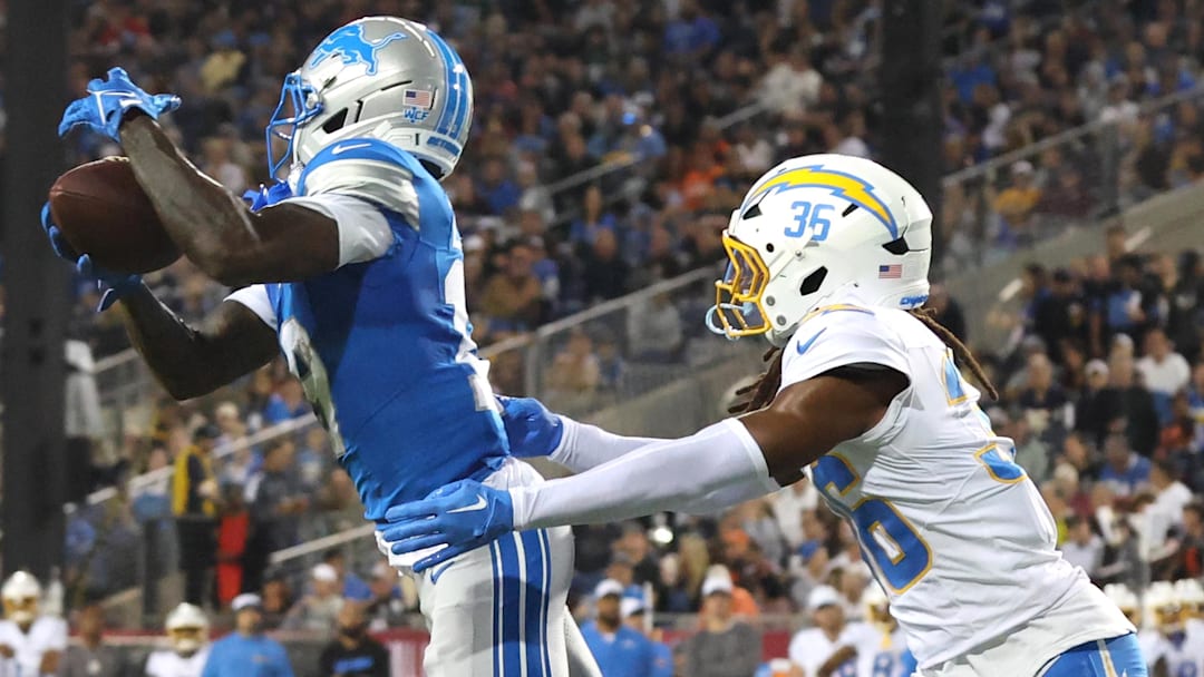 Los Angeles Chargers cornerback Ja'Sir Taylor (36) tackles Detroit Lions wide receiver Dominic Lovett (19) in the second quarter at Tom Benson Hall of Fame Stadium.