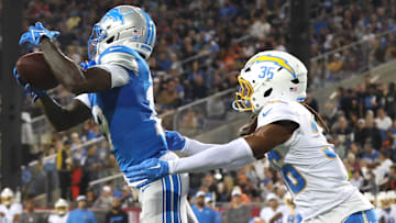 Los Angeles Chargers cornerback Ja'Sir Taylor (36) tackles Detroit Lions wide receiver Dominic Lovett (19) in the second quarter at Tom Benson Hall of Fame Stadium.
