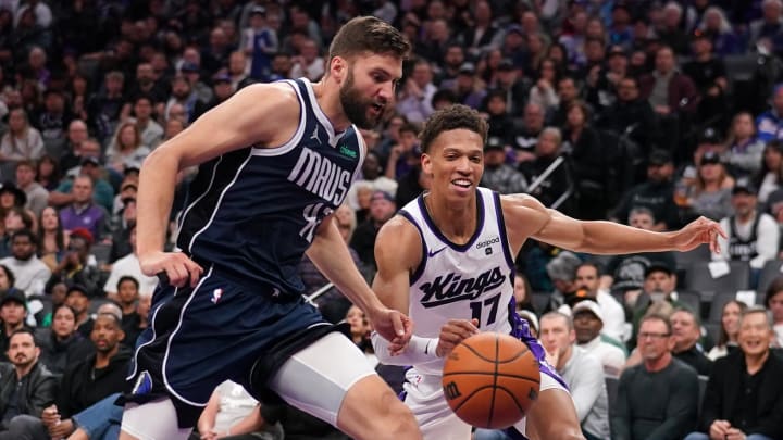 Mar 29, 2024; Sacramento, California, USA; Dallas Mavericks forward Maxi Kleber (42) and Sacramento Kings forward Kessler Edwards (17) attempt to gain control of a loose ball in the third quarter at the Golden 1 Center. Mandatory Credit: Cary Edmondson-USA TODAY Sports