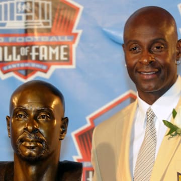Aug 7, 2010; Canton, OH, USA; Jerry Rice poses with his bust at the 2010 Pro Football Hall of Fame enshrinement ceremony at Fawcett Stadium. Mandatory Credit: Kirby Lee/Image of Sport-Imagn Images