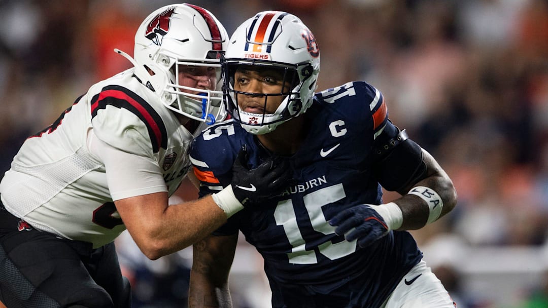 Auburn Tigers defensive end Keldric Faulk blitzes as the Auburn Tigers take on Ball State Cardinals at Jordan-Hare Stadium