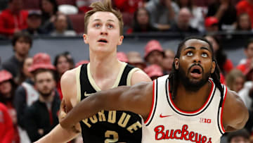 Purdue Boilermakers guard Fletcher Loyer is boxed out by Ohio State Buckeyes guard Evan Mahaffey 