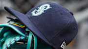 May 12, 2018; Detroit, MI, USA; Hat and glove of Seattle Mariners center fielder Dee Gordon (9) sits in dugout during the third inning against the Detroit Tigers at Comerica Park. 