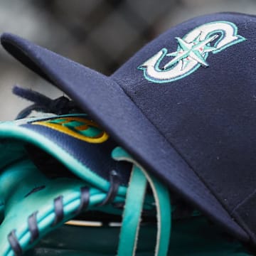 May 12, 2018; Detroit, MI, USA; Hat and glove of Seattle Mariners center fielder Dee Gordon (9) sits in dugout during the third inning against the Detroit Tigers at Comerica Park. 