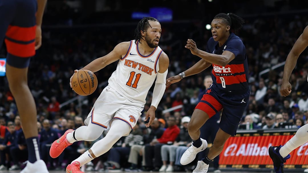 Dec 28, 2024; Washington, District of Columbia, USA; New York Knicks guard Jalen Brunson (11) drives to the basket as Washington Wizards guard Bub Carrington (8) defends in the first quarter at Capital One Arena. Mandatory Credit: Geoff Burke-Imagn Images